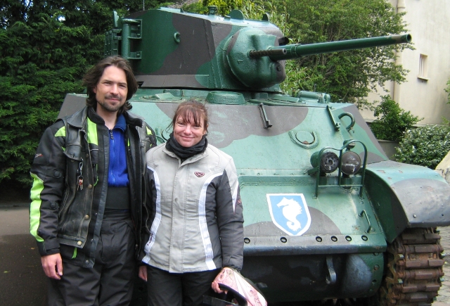 the editor and his girlfriend stood next to a small tank at the grand bunker